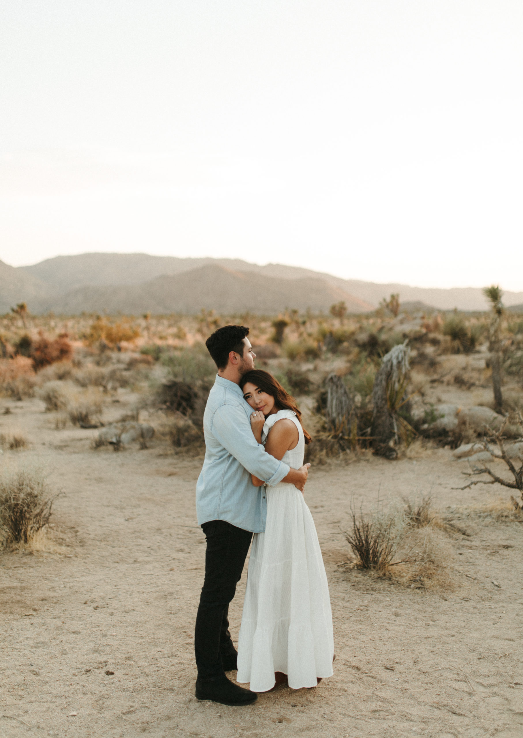 A romantic and earthy engagement session in the Joshua Tree National Park desert during sunset by Lauryn Victoria, a California Elopement Photographer.